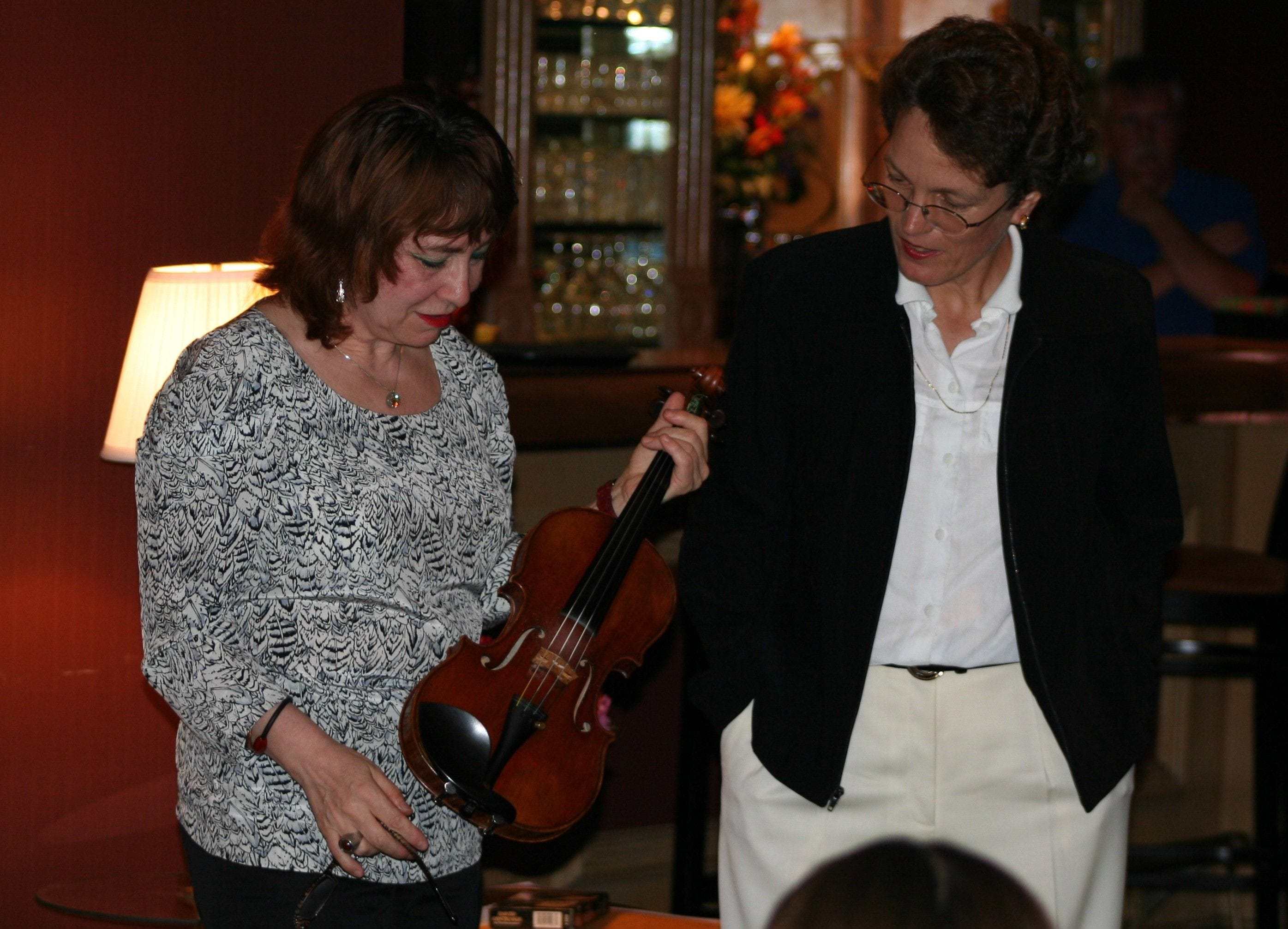 Rimma Sushanskaya, Violinist and OCO Music Director Roberta Carpenter, explain the nature of violins to 'The Score Came Second...' series attendees.
